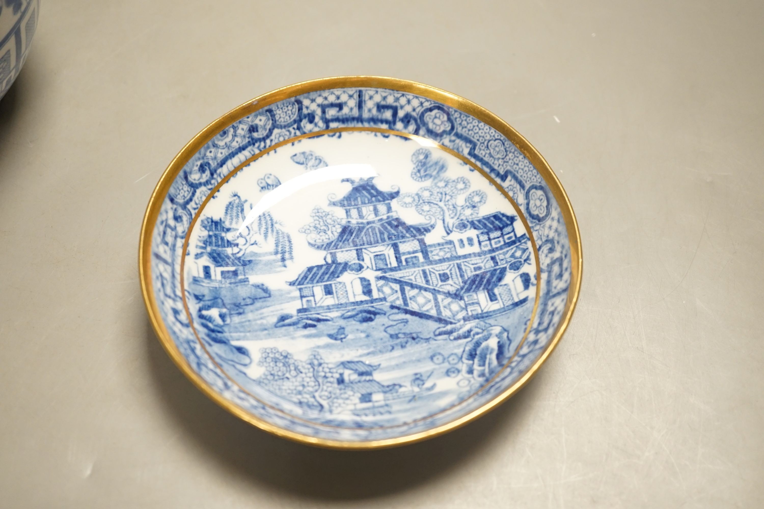 A New Hall slops bowl printed with the 'Duck' pattern and a teabowl and saucer printed with the 'Moth' pattern c.1790, Slops bowl 15.5 cms diameter.